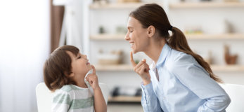 woman and young kid smiling
