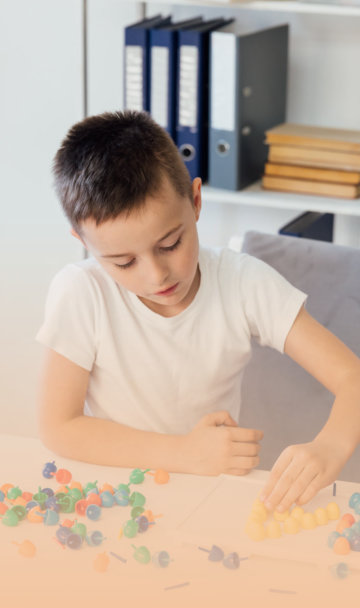 woman with young kid forming letters